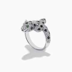 A stunning 14K White Gold Panther Ring adorned with white and black diamonds and vivid emerald eyes, shown against a white background.