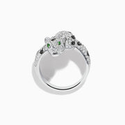 A stunning 14K White Gold Panther Ring adorned with white and black diamonds and vivid emerald eyes, shown against a white background.