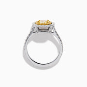 The 18K Gold Yellow and White Double Halo GIA Certified Diamond Ring showcases a large rectangular yellow diamond center, framed by double halos of round white diamonds and a diamond-adorned band.