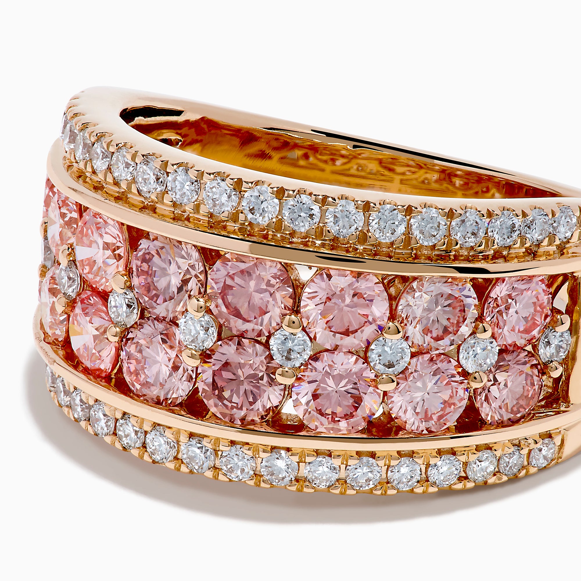 The Lab Grown Pink and White Diamond Statement Ring in 14K Rose Gold features a wide band with two rows of lab grown white diamonds on the edges and a central line of closely set pink diamonds for an elegant, eye-catching look.