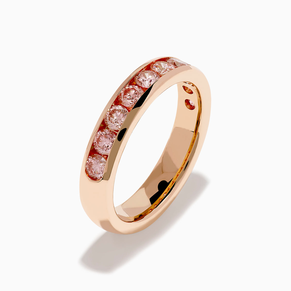 The Lab Grown Pink Diamond Channel Set Band in 14K Rose Gold features a row of round lab grown pink diamonds set in a channel band, shown against a plain white background.
