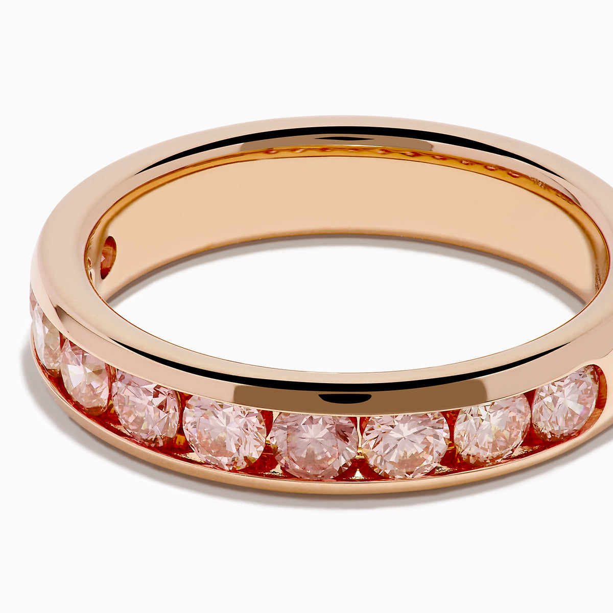The Lab Grown Pink Diamond Channel Set Band in 14K Rose Gold features a row of round lab grown pink diamonds set in a channel band, shown against a plain white background.