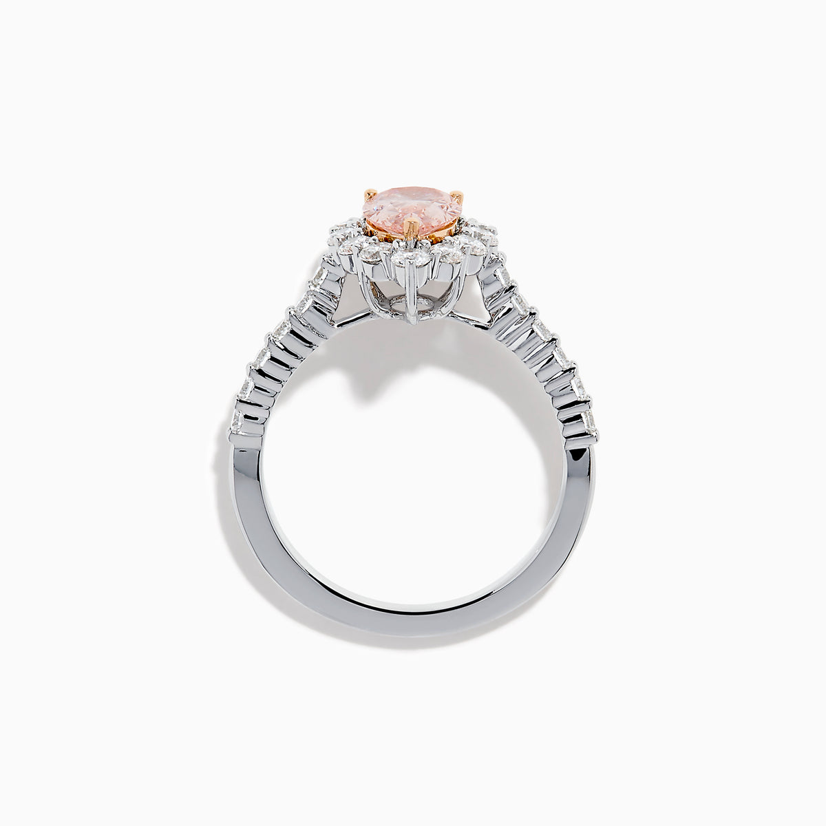 The Lab Grown Pink and White Diamond Halo Ring in 14K Two Tone Gold features a pear-shaped pink center, a halo of white diamonds, and a diamond-studded band, shown on a white background.