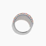 The Lab Grown Pink and White Diamond Wide Band Ring in 14K White Gold features a central row of pink gemstones bordered by sparkling white diamonds on a wide, polished band, beautifully set against a white background.
