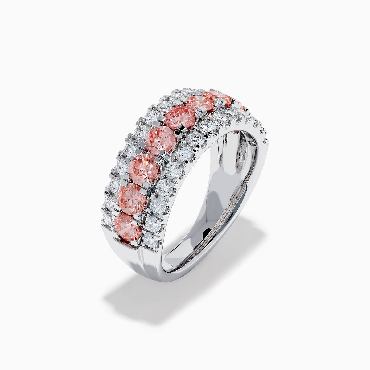 The Lab Grown Pink and White Diamond Wide Band Ring in 14K White Gold features a central row of pink gemstones bordered by sparkling white diamonds on a wide, polished band, beautifully set against a white background.