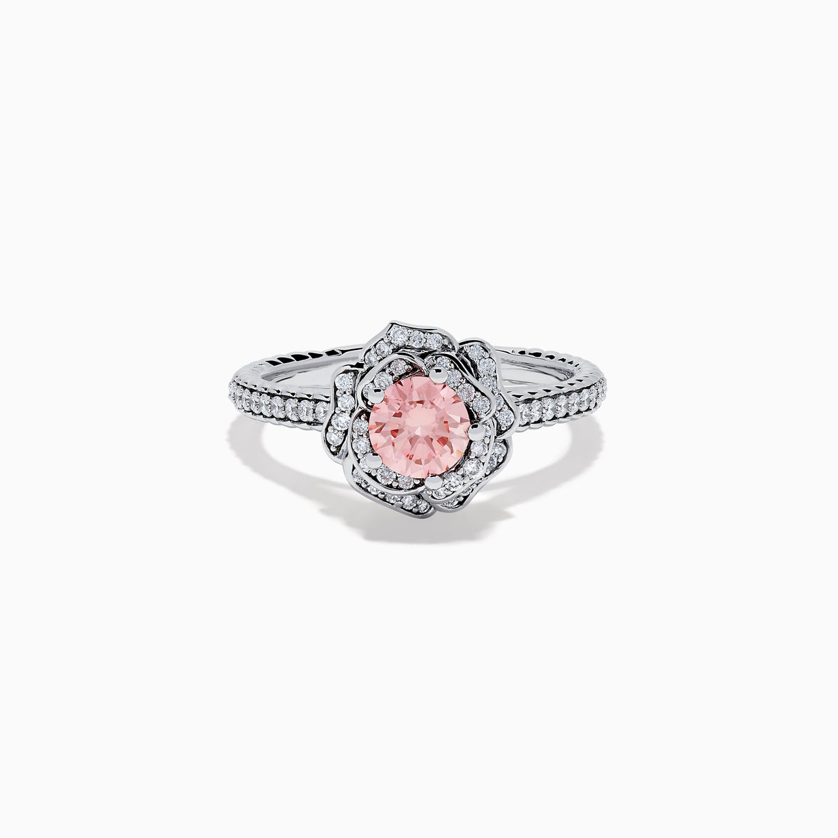 The Lab Grown Pink and White Diamond Rose Ring in 14K White Gold features a round pink center stone, a floral halo of lab grown diamonds, and additional diamonds along the band.