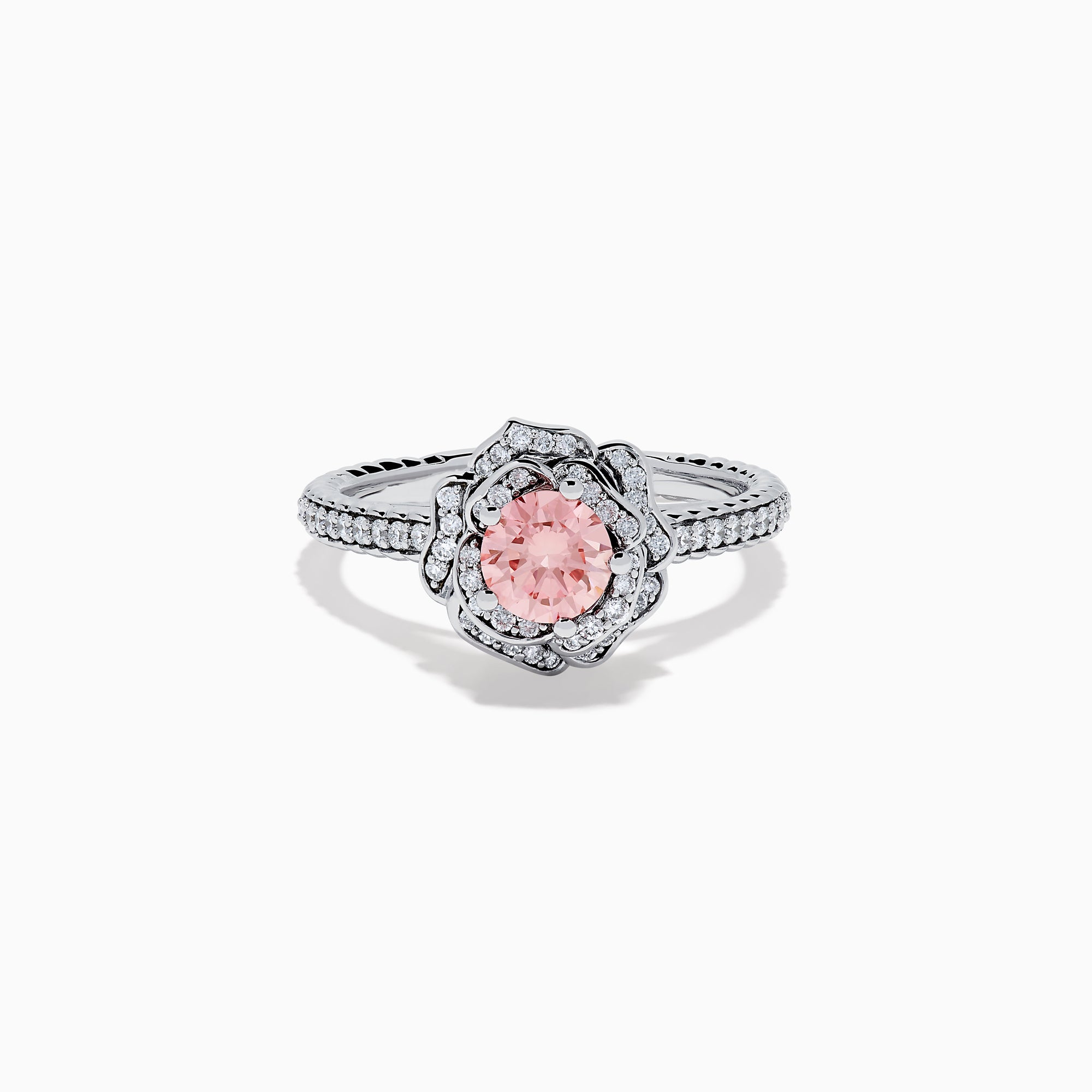 The Lab Grown Pink and White Diamond Rose Ring in 14K White Gold features a round pink center stone, a floral halo of lab grown diamonds, and additional diamonds along the band.