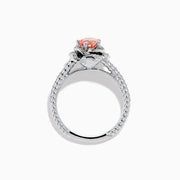 The Lab Grown Pink and White Diamond Rose Ring in 14K White Gold features a round pink center stone, a floral halo of lab grown diamonds, and additional diamonds along the band.