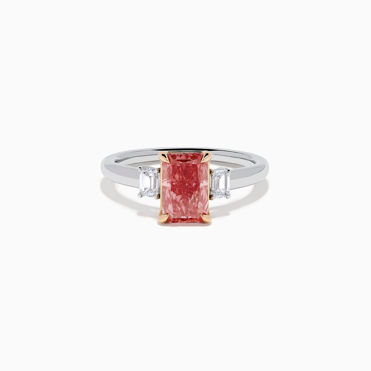 The Lab Grown Pink and White Diamond 3 Stone Ring in 14K White Gold features a rectangular pink and white diamond centerpiece with two clear baguette-cut side stones, set on a simple, elegant band.