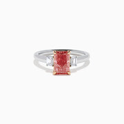 The Lab Grown Pink and White Diamond 3 Stone Ring in 14K White Gold features a rectangular pink and white diamond centerpiece with two clear baguette-cut side stones, set on a simple, elegant band.