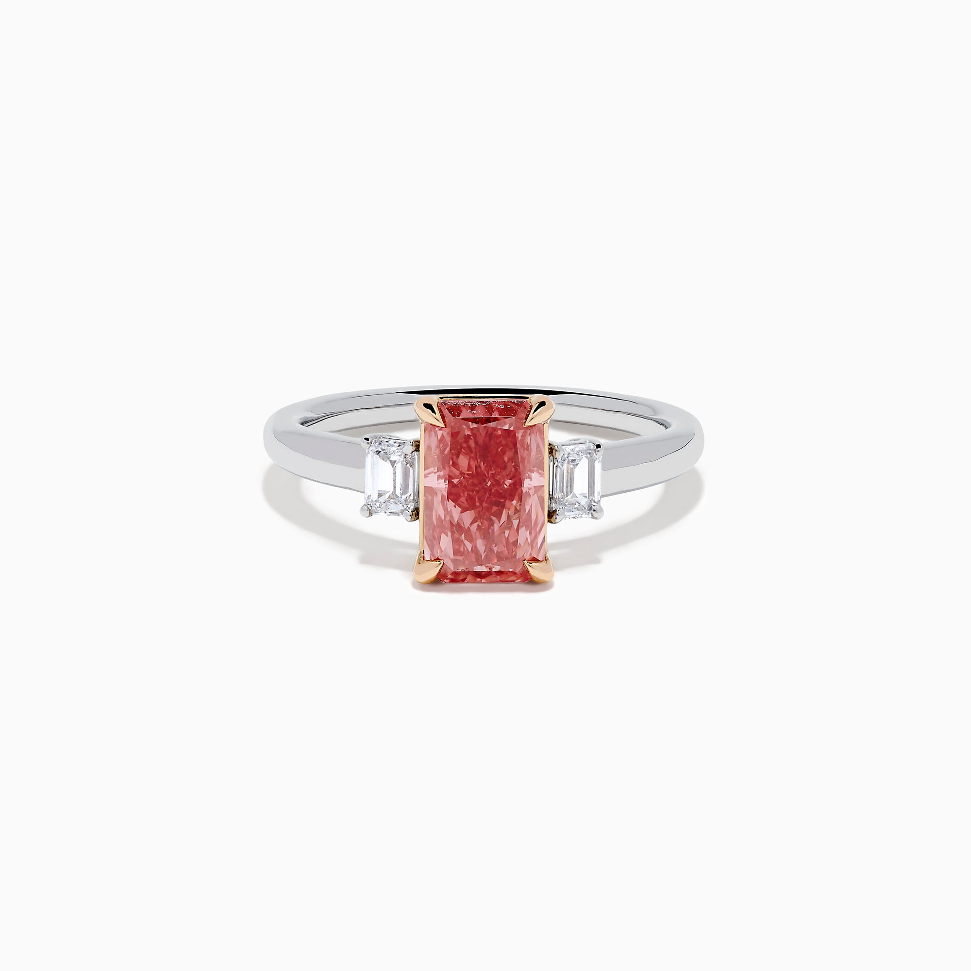 The Lab Grown Pink and White Diamond 3 Stone Ring in 14K White Gold features a rectangular pink and white diamond centerpiece with two clear baguette-cut side stones, set on a simple, elegant band.