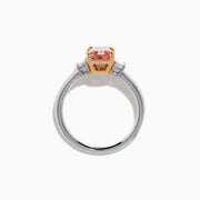 The Lab Grown Pink and White Diamond 3 Stone Ring in 14K White Gold features a rectangular pink and white diamond centerpiece with two clear baguette-cut side stones, set on a simple, elegant band.