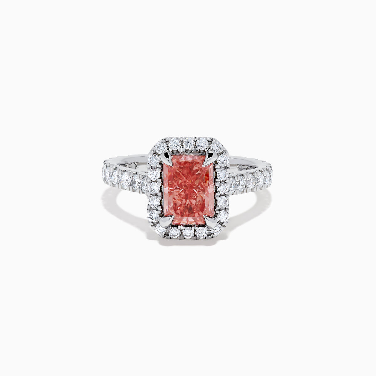 The Lab Grown Pink and White Diamond Halo Ring in 14K White Gold features a rectangular pink gemstone, a halo of lab grown diamonds, and a diamond-studded band, elegantly showcased on a white background.