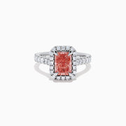 The Lab Grown Pink and White Diamond Halo Ring in 14K White Gold features a rectangular pink gemstone, a halo of lab grown diamonds, and a diamond-studded band, elegantly showcased on a white background.