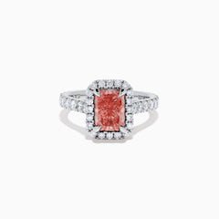 The Lab Grown Pink and White Diamond Halo Ring in 14K White Gold features a rectangular pink gemstone, a halo of lab grown diamonds, and a diamond-studded band, elegantly showcased on a white background.
