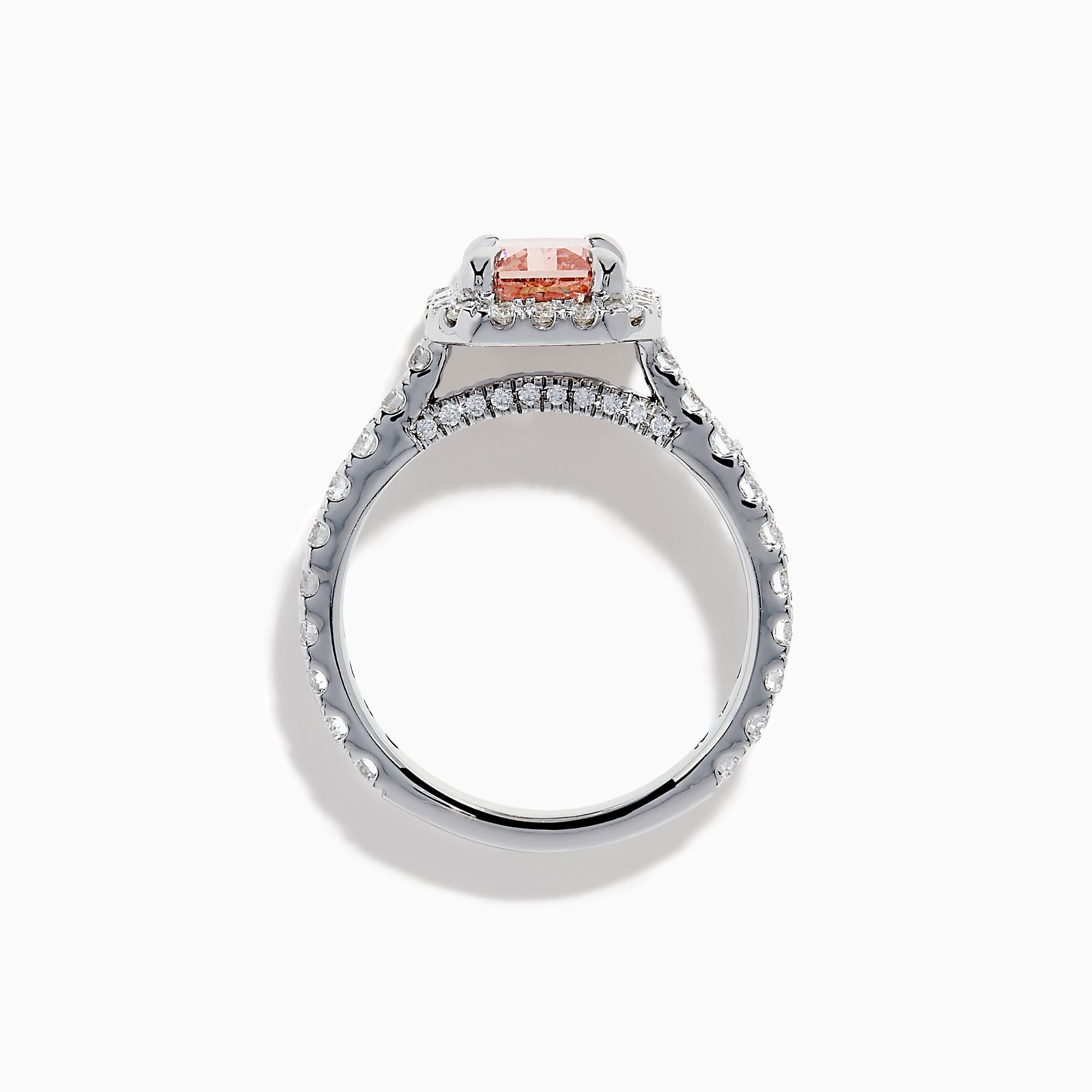 The Lab Grown Pink and White Diamond Halo Ring in 14K White Gold features a rectangular pink gemstone, a halo of lab grown diamonds, and a diamond-studded band, elegantly showcased on a white background.