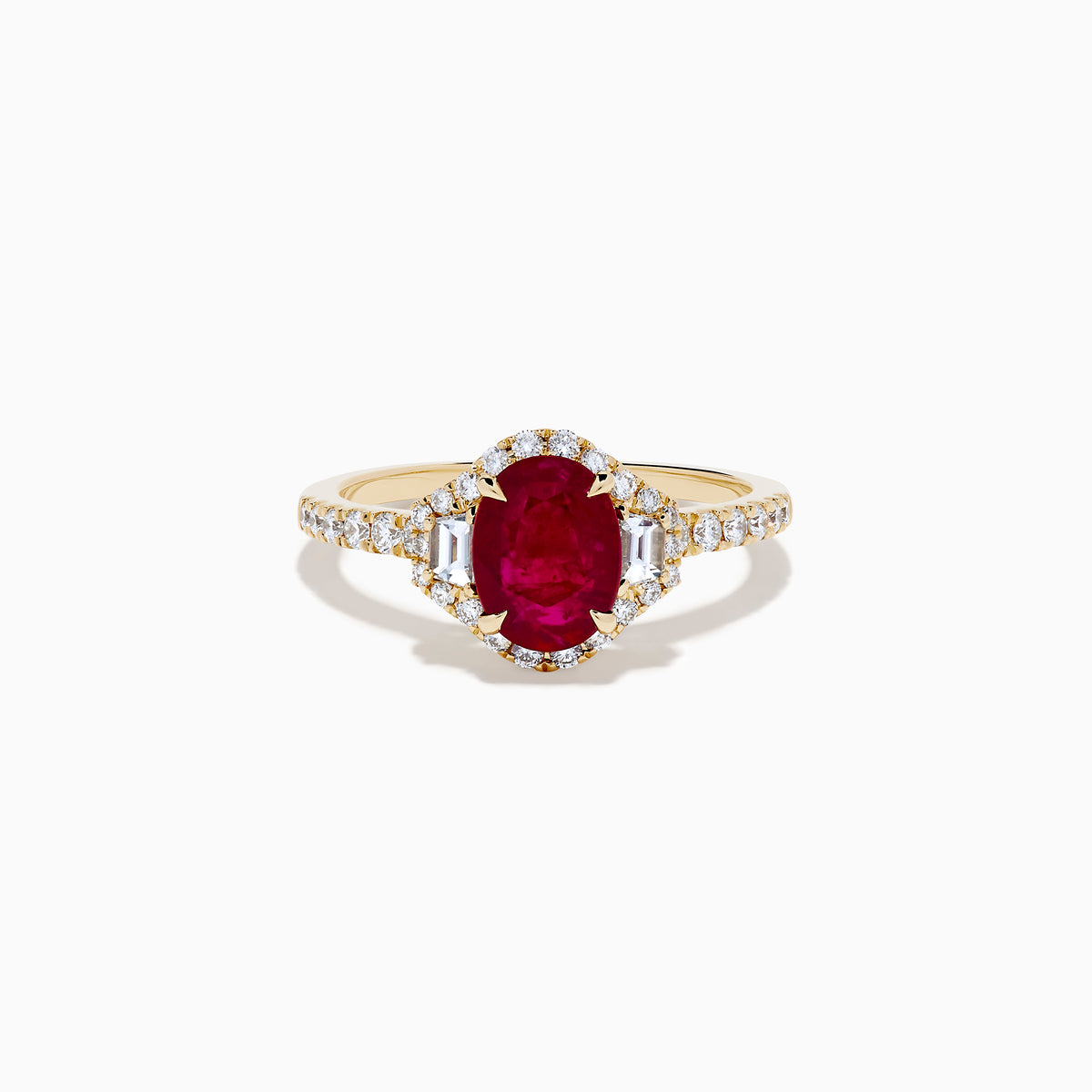 The Ruby Royale 14K Yellow Gold Ruby and Diamond 3 Stone Ring showcases a central oval ruby flanked by sparkling diamonds, set on a diamond-accented band and elegantly displayed against a white background.
