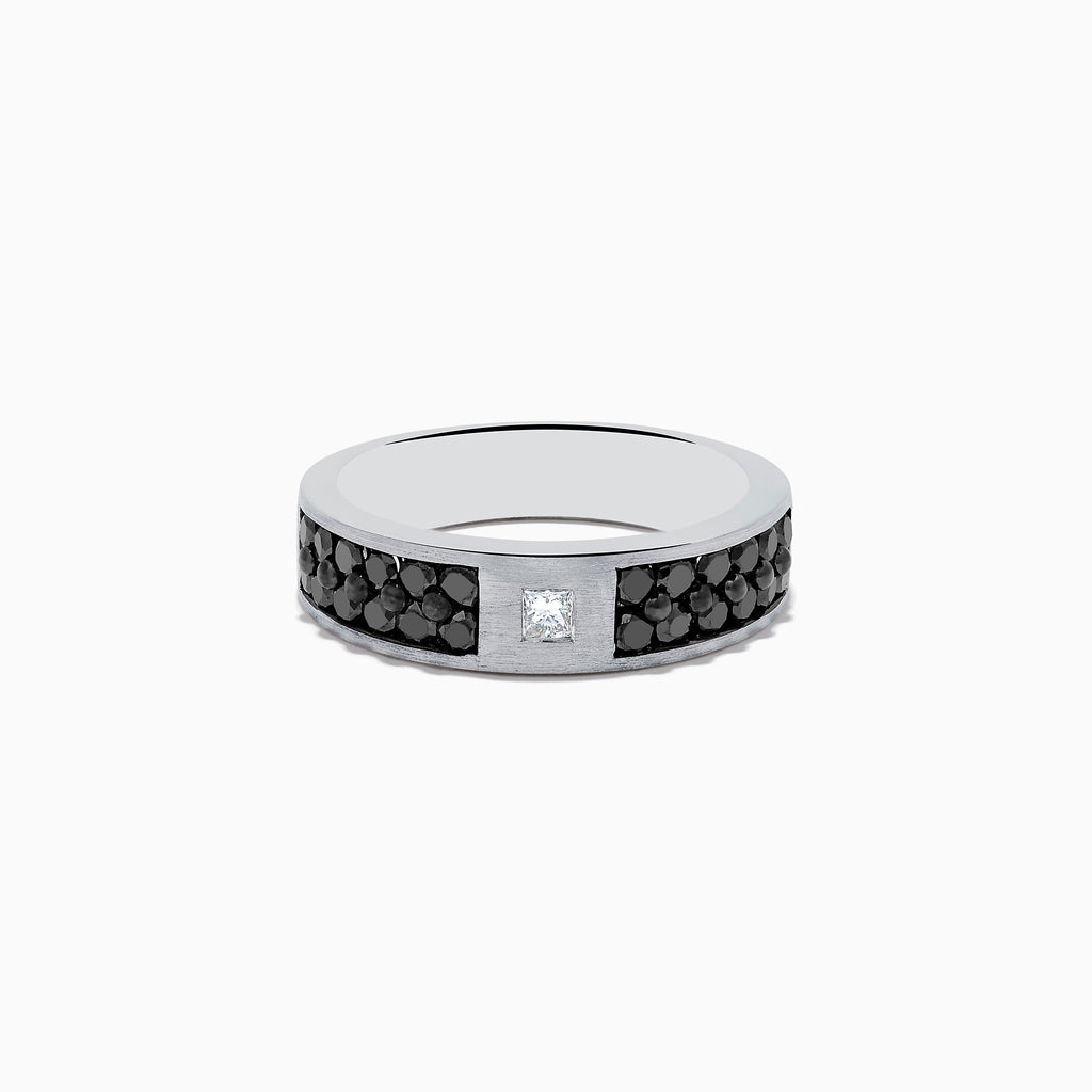 The 14K White Gold Mens Black and White Diamond Ring features a 1.15 TCW square white diamond center, accented by small round black stones along the silver band for a bold black-and-white contrast.
