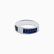 Men’s 14K White Gold Blue Sapphire and Diamond Ring, 1.69 TCW, showcasing a row of blue sapphires on the band with a single square-cut diamond at the center.