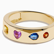 The Watercolors 14K Yellow Gold Multi Sapphire Wedding Band features five sapphires in square, rectangular, heart, oval, and round shapes set evenly around the band.