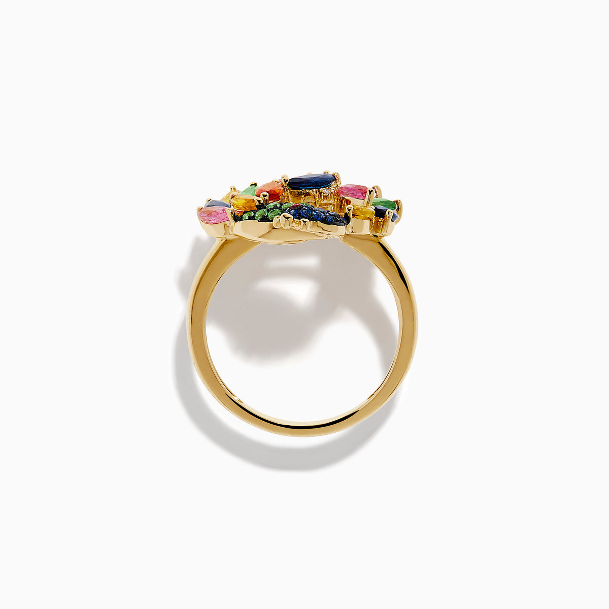 The Watercolors 14K Yellow Gold Multi Sapphire Peacock Ring features a vibrant peacock design with blue, green, pink, yellow, and orange sapphires, capturing the beauty of the bird’s feathered tail against a crisp white background.