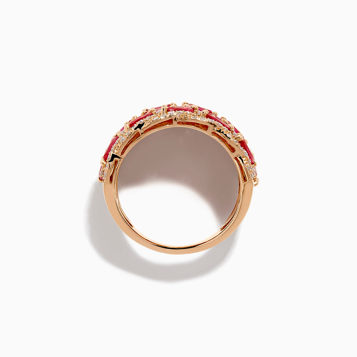 The 14K Rose Gold Marquise Ruby and Diamond Leaf Statement Ring showcases rows of marquise rubies and round white diamonds in an intricate overlapping leaf design.