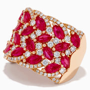 The 14K Rose Gold Marquise Ruby and Diamond Leaf Statement Ring showcases rows of marquise rubies and round white diamonds in an intricate overlapping leaf design.