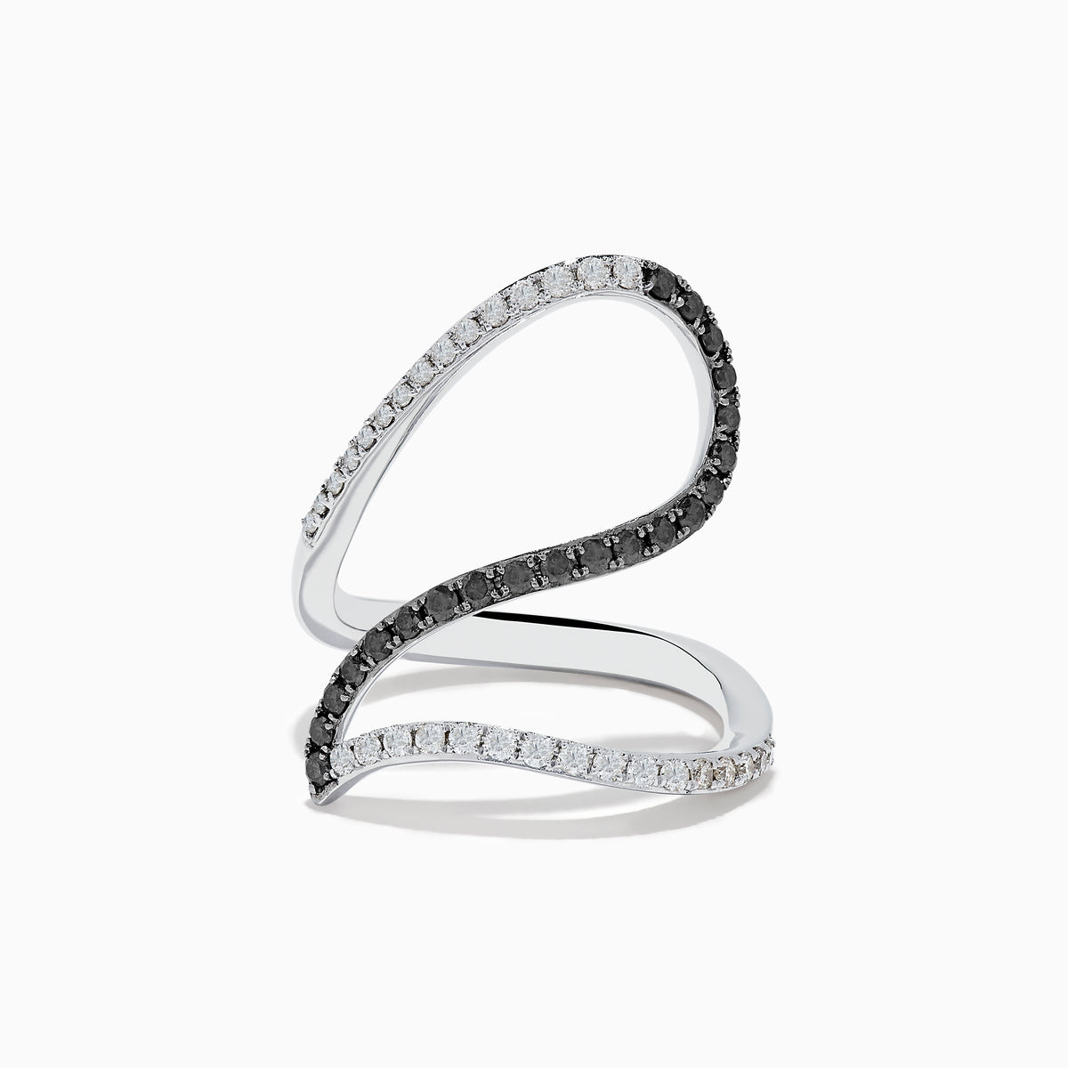The 14K White Gold Black and White Diamond Fashion Ring features an open, wavy design with intertwined bands of sparkling white and black diamonds, creating a modern and elegant look.