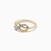 The Novelty 14K Yellow Gold Diamond Infinity Knot Ring, 0.05 TCW, features interlocking loops with a diamond-encrusted curve on the front and is shown against a white background.