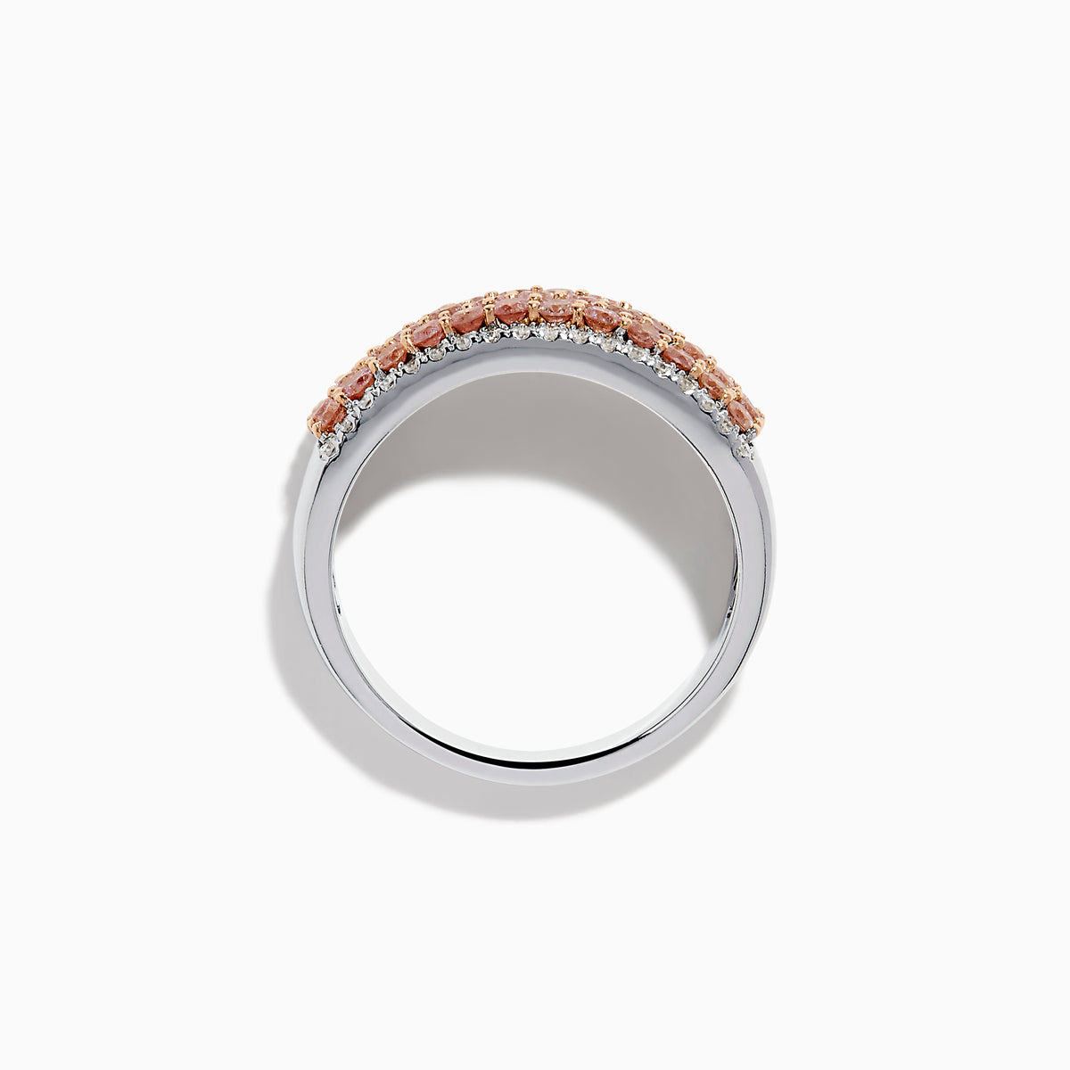 The 14K Two-Tone Gold Pink and White Diamond Ring showcases alternating rows of sparkling white and pink diamonds, blending the brilliance of white stones with the warmth of rose gold for an elegant, eye-catching look.