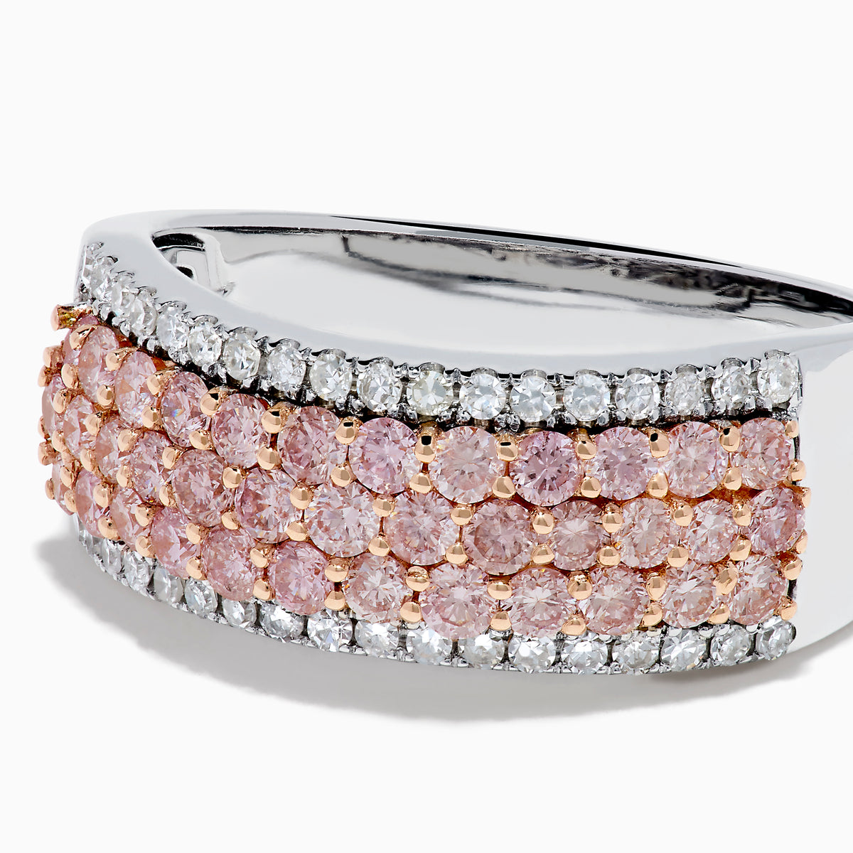 The 14K Two-Tone Gold Pink and White Diamond Ring showcases alternating rows of sparkling white and pink diamonds, blending the brilliance of white stones with the warmth of rose gold for an elegant, eye-catching look.