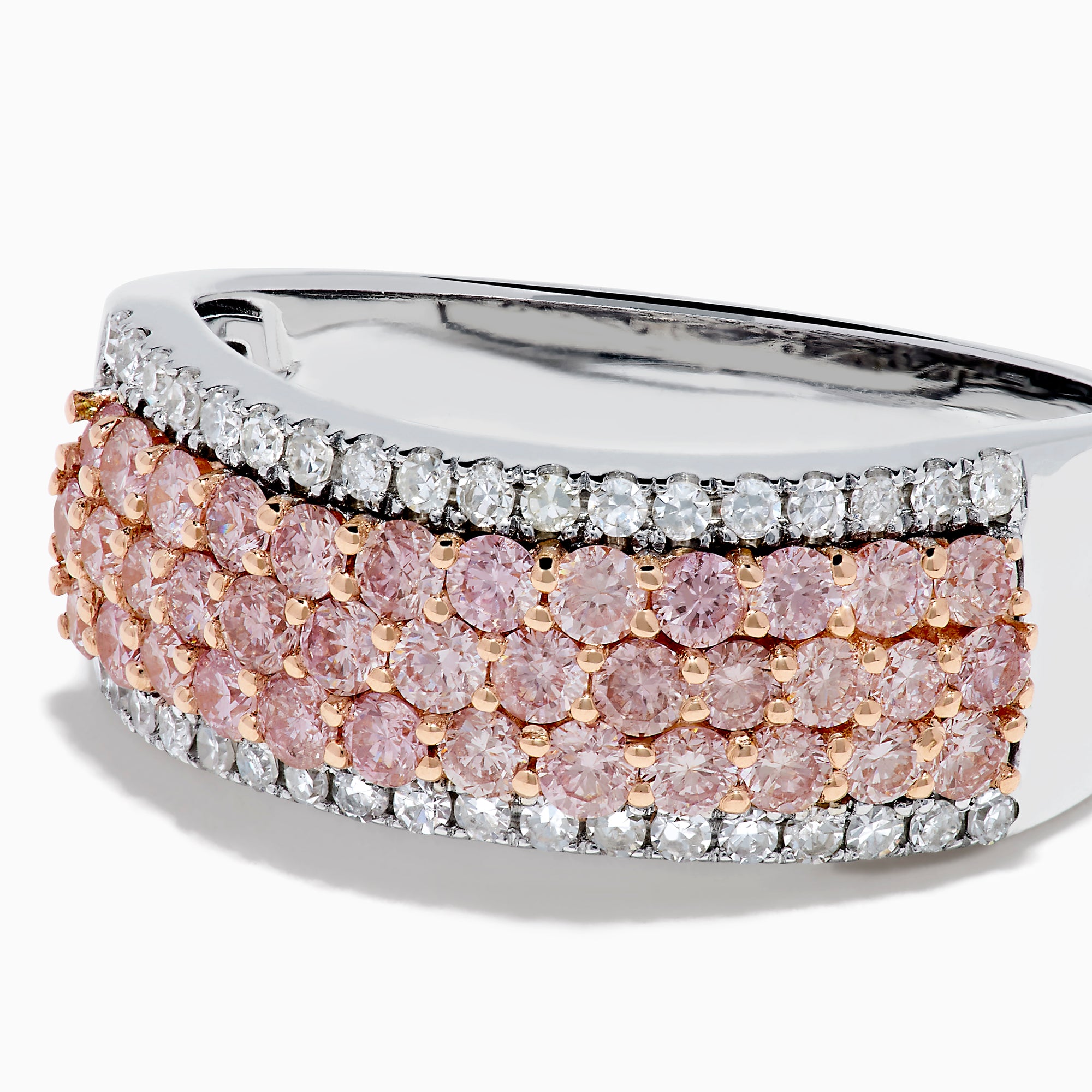 The 14K Two-Tone Gold Pink and White Diamond Ring showcases alternating rows of sparkling white and pink diamonds, blending the brilliance of white stones with the warmth of rose gold for an elegant, eye-catching look.