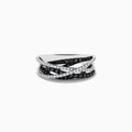 A 14K White Gold Black and White Diamond Ring (.72 TCW) with intertwined bands—one adorned with black diamonds, the other with white stones—displayed against a plain white background.