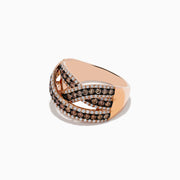The 14K Rose Gold Diamond Criss Cross Ring, 1.06 TCW, showcases interwoven bands with brown and white diamonds in intricate rows, displayed on a white background.