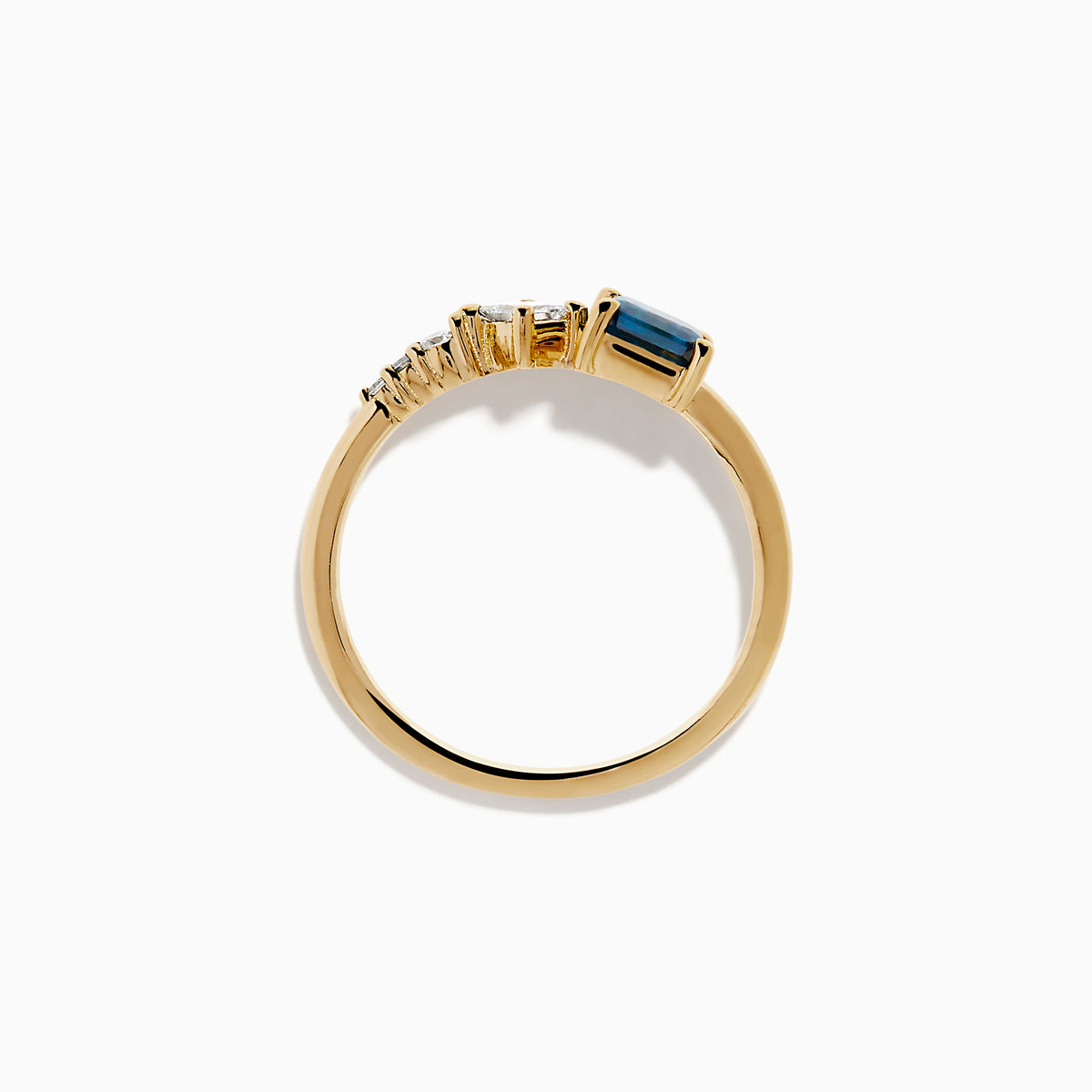 The 14K Yellow Gold Blue and White Diamond Ring features a square blue diamond, a smaller square white diamond, and three round white stones set asymmetrically on a plain band.
