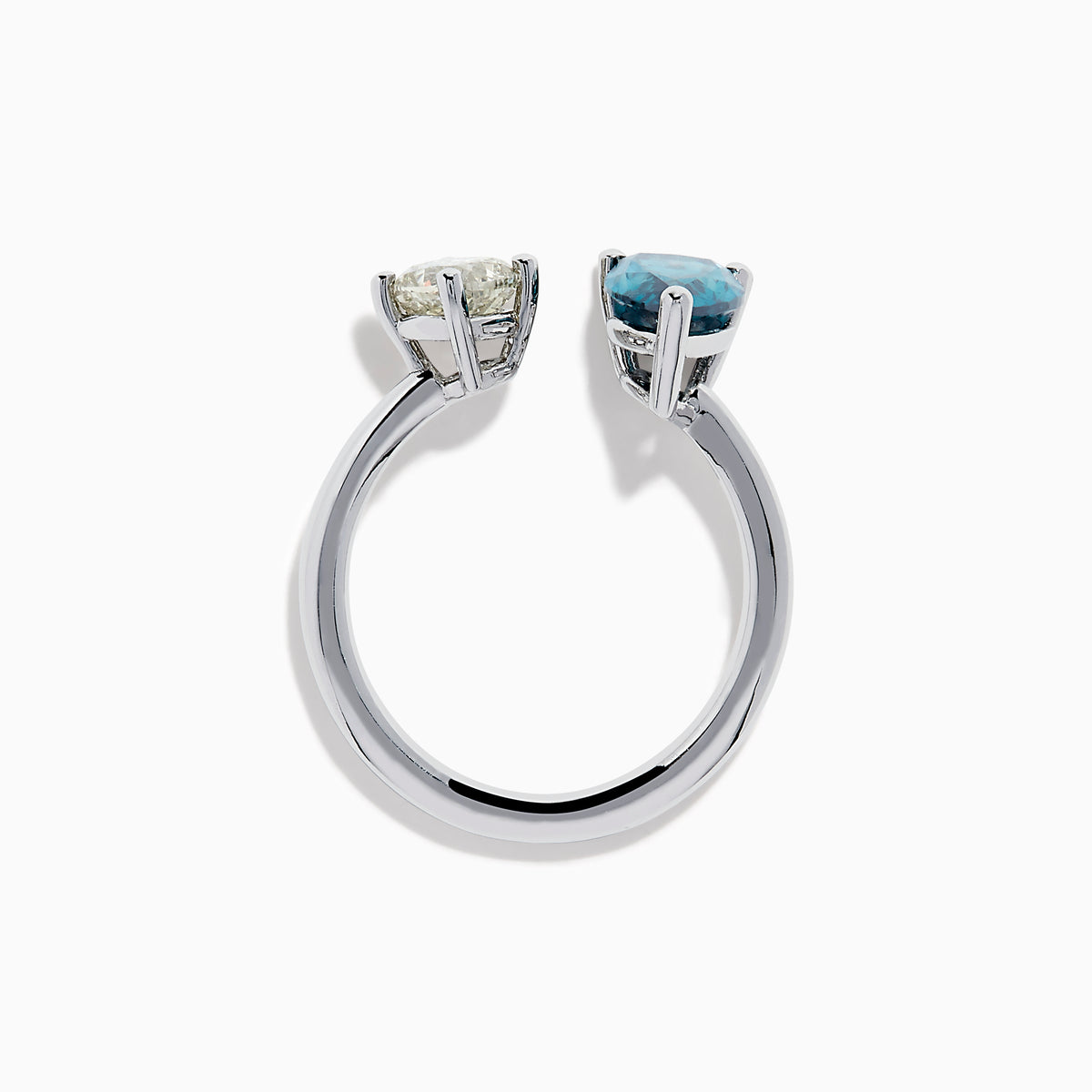 The 14K White Gold Blue and White Diamond Toi Et Moi Ring features a pear-shaped blue diamond and a square white diamond set side by side on an open band, displayed against a white background.