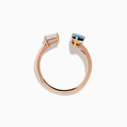 The 14K Rose Gold Blue and White Diamond Toi Et Moi Ring features an open design with a clear rectangular diamond and a blue teardrop diamond, elegantly displayed on a white background.