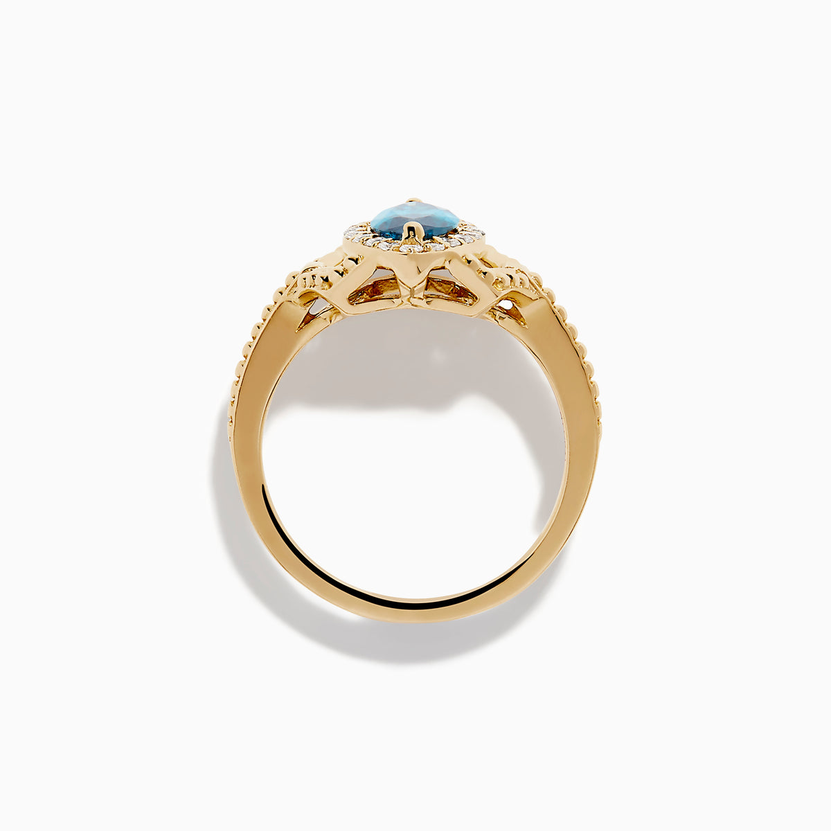 The 14K Yellow Gold Blue and White Diamond Marquise Ring features a striking blue and white diamond centerpiece, accented by a halo of round white diamonds and detailed band craftsmanship.
