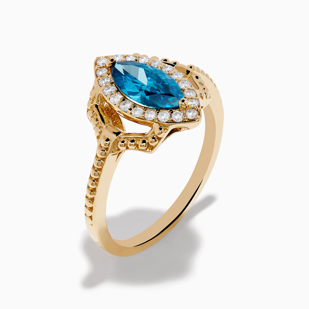 The 14K Yellow Gold Blue and White Diamond Marquise Ring features a striking blue and white diamond centerpiece, accented by a halo of round white diamonds and detailed band craftsmanship.