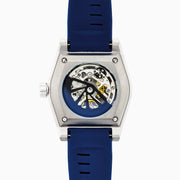 A modern 42MM Swiss Made Titanium Automatic Skeleton Watch with a blue strap, silver geometric case, and skeleton dial revealing intricate gears. Blue and silver hands complete this stylish Effy Watches timepiece.