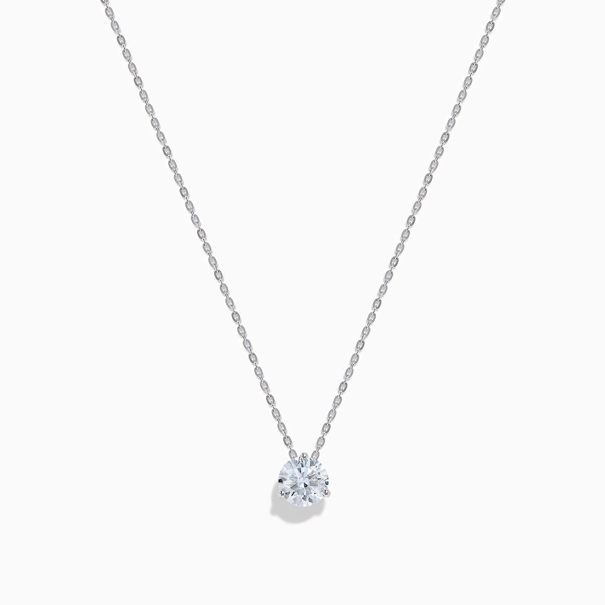 The Lab Grown Diamond Earring and Necklace Set in 14K White Gold features a heart-shaped diamond pendant on a silver necklace and matching heart-shaped diamond stud earrings, all showcased on a white background.