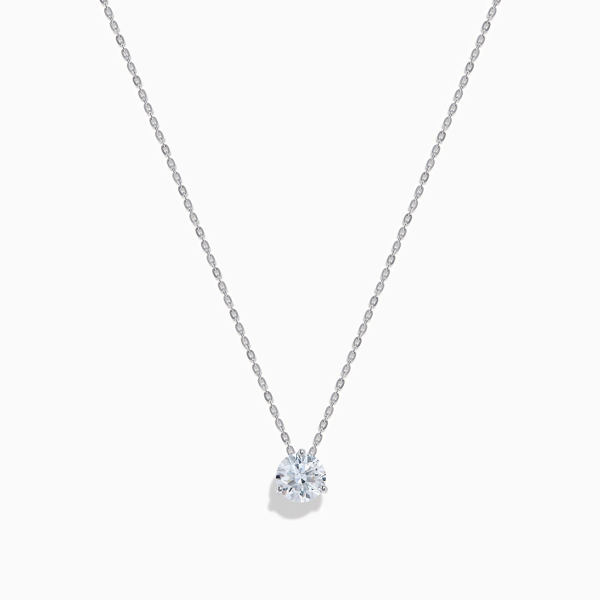 The Lab Grown Diamond Earring and Necklace Set in 14K White Gold features a heart-shaped diamond pendant on a silver necklace and matching heart-shaped diamond stud earrings, all showcased on a white background.
