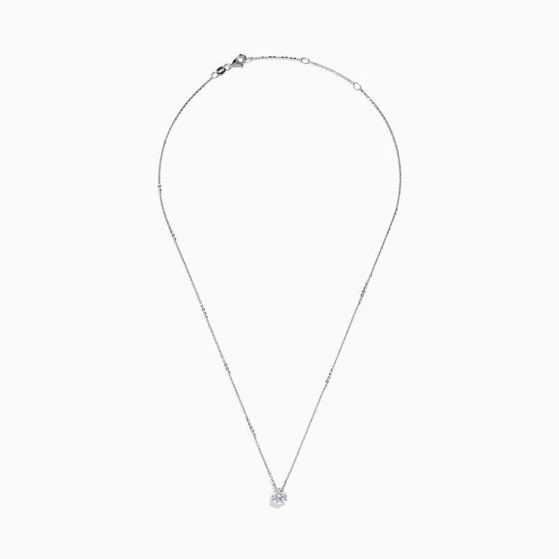 The Lab Grown Diamond Earring and Necklace Set in 14K White Gold features a heart-shaped diamond pendant on a silver necklace and matching heart-shaped diamond stud earrings, all showcased on a white background.