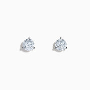 The Lab Grown Diamond Earring and Necklace Set in 14K White Gold features a heart-shaped diamond pendant on a silver necklace and matching heart-shaped diamond stud earrings, all showcased on a white background.