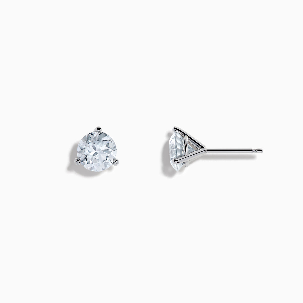 The Lab Grown Diamond Earring and Necklace Set in 14K White Gold features a heart-shaped diamond pendant on a silver necklace and matching heart-shaped diamond stud earrings, all showcased on a white background.
