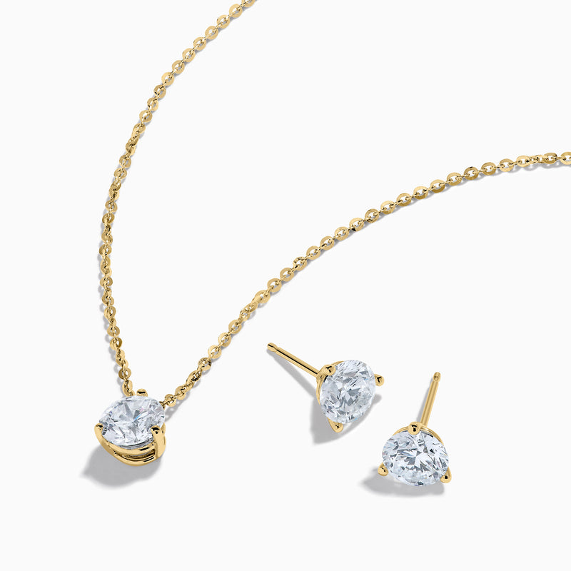 The Lab Grown Diamond Earring and Necklace Set in 14K Yellow Gold features a round diamond pendant and matching gold stud earrings, each showcasing a single round lab grown diamond, displayed on a white background.