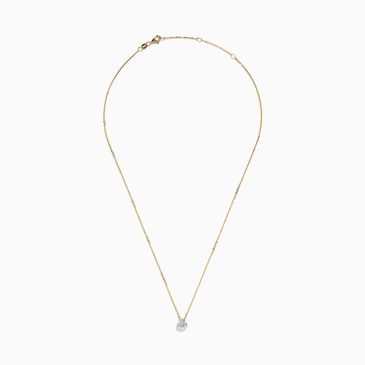The Lab Grown Diamond Earring and Necklace Set in 14K Yellow Gold features a round diamond pendant and matching gold stud earrings, each showcasing a single round lab grown diamond, displayed on a white background.