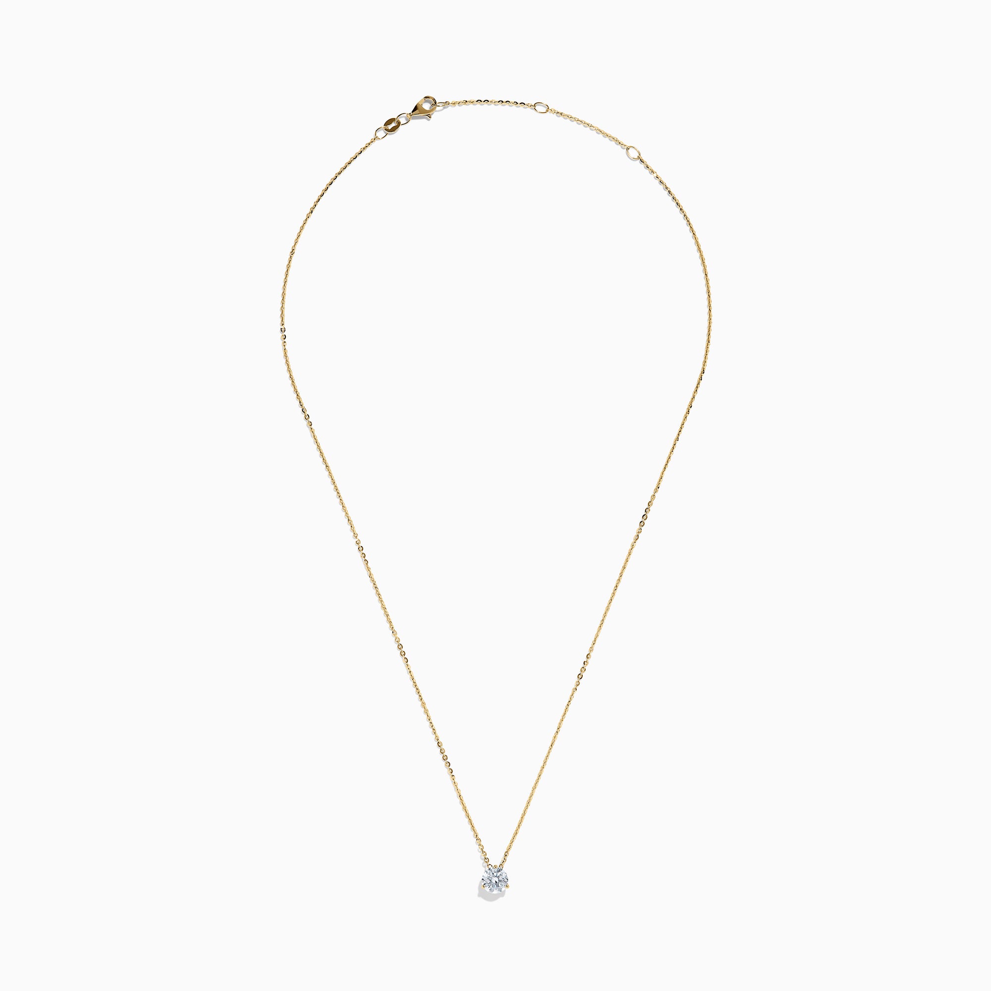 The Lab Grown Diamond Earring and Necklace Set in 14K Yellow Gold features a round diamond pendant and matching gold stud earrings, each showcasing a single round lab grown diamond, displayed on a white background.