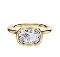 A 14K yellow gold Bezel Full Bezel East/West Classic Dome 2.0mm engagement ring featuring a cushion-cut, clear diamond, shown on a plain white background.