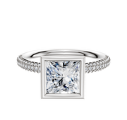 A 14K white gold engagement ring with a full bezel north/south classic dome setting, showcasing a square-cut center stone and 3 rows of pave diamonds along the band.